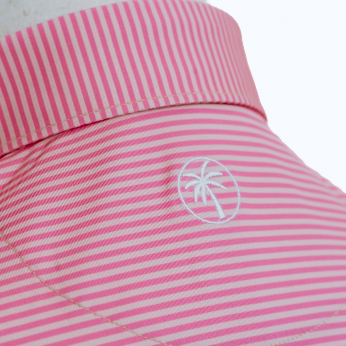 Back view of the Palmetto Clothing The Classic Stripe Polo in Peach showcasing the comfortable athletic fit and premium construction that make it a favorite golf shirt on and off the course.
