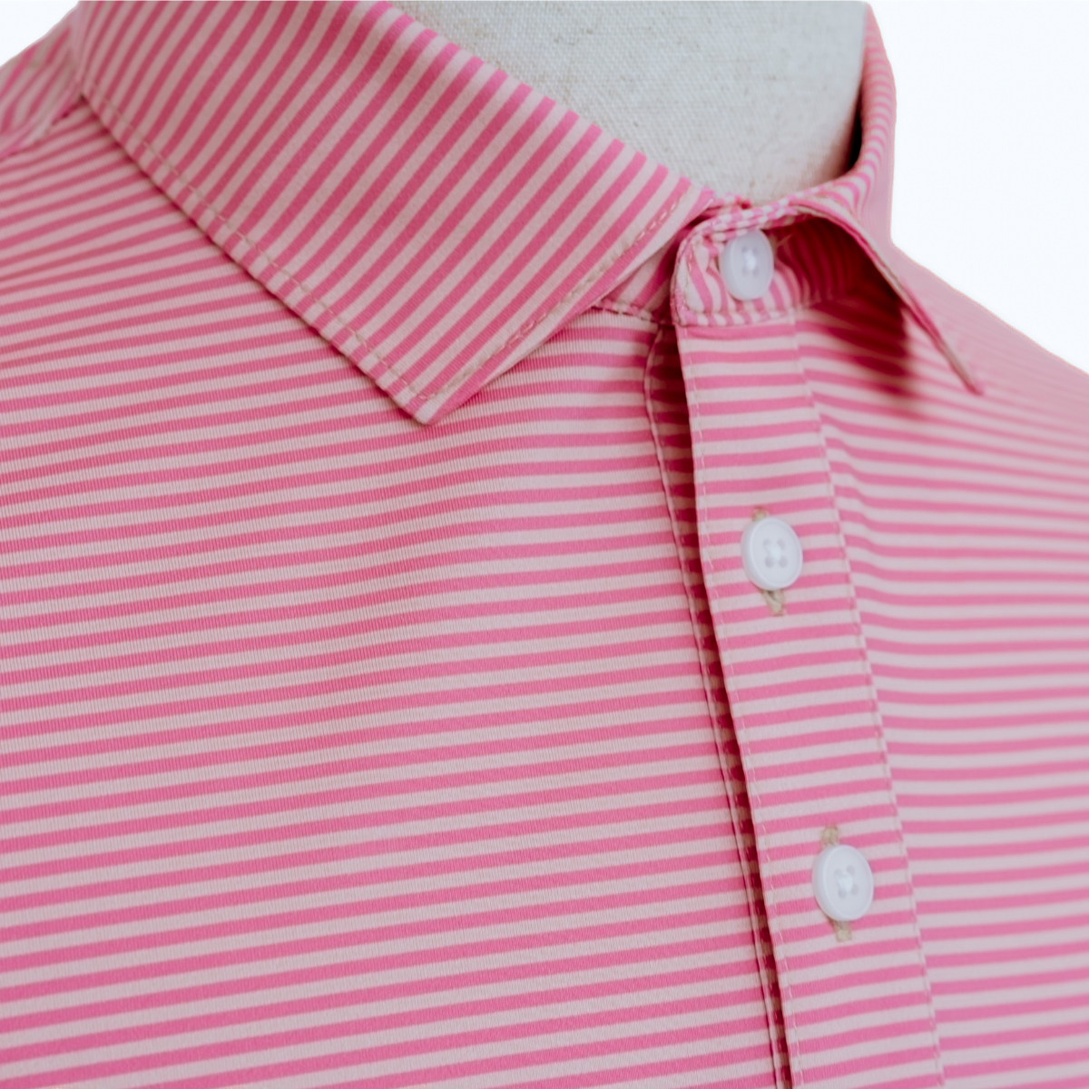 Close-up product detail of the Palmetto Clothing The Classic Stripe Polo in Peach highlighting the soft performance fabric, refined stitching, and premium finish expected from the best mens golf polo.