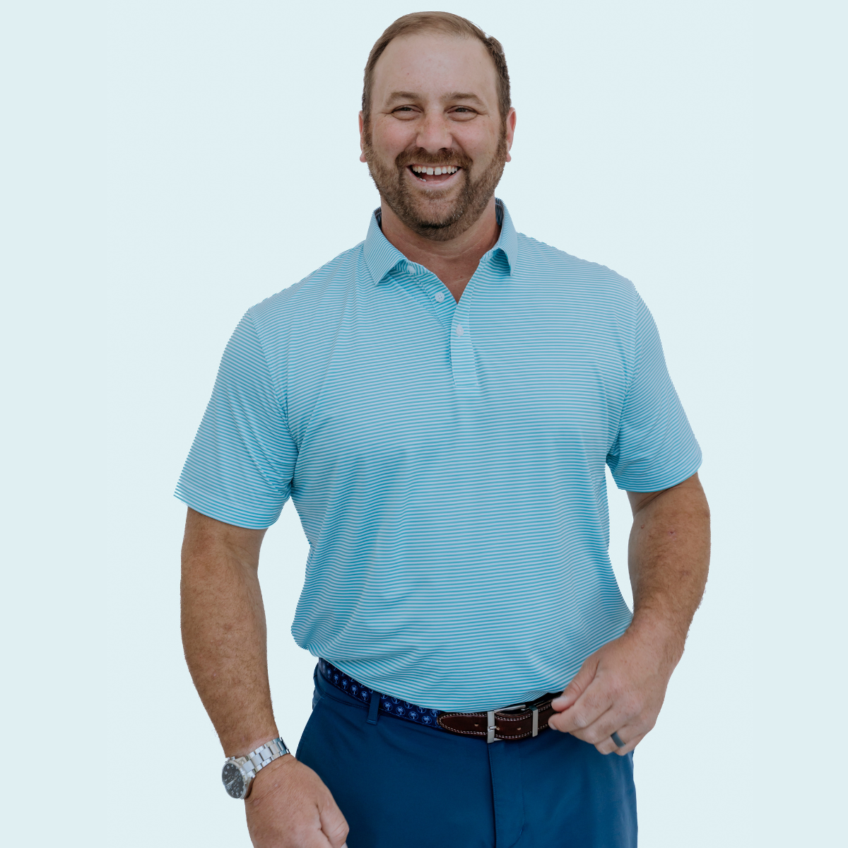 Front view of the Palmetto Clothing The Classic Stripe Polo in Teal featuring clean white and teal stripes. A breathable golf shirt built for comfort from the first tee to the clubhouse.