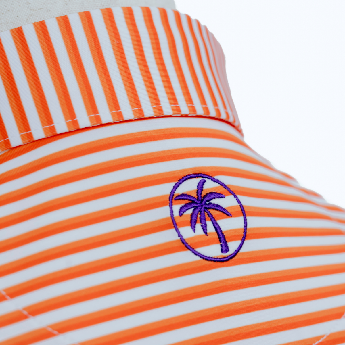 Back view of the Palmetto Clothing The Double Double Polo in Orange highlighting the athletic fit, breathable construction, and lightweight performance fabric built for every round.