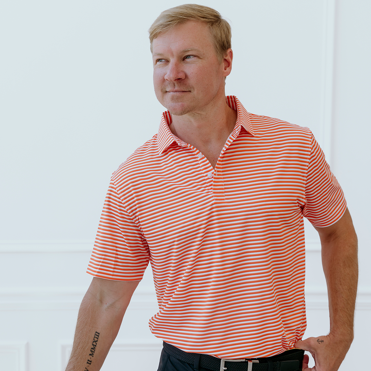 Front view of the Palmetto Clothing The Double Double Polo in Orange showcasing the bold double stripe pattern and premium construction. Part of our best golf apparel collection designed for comfort and timeless style.