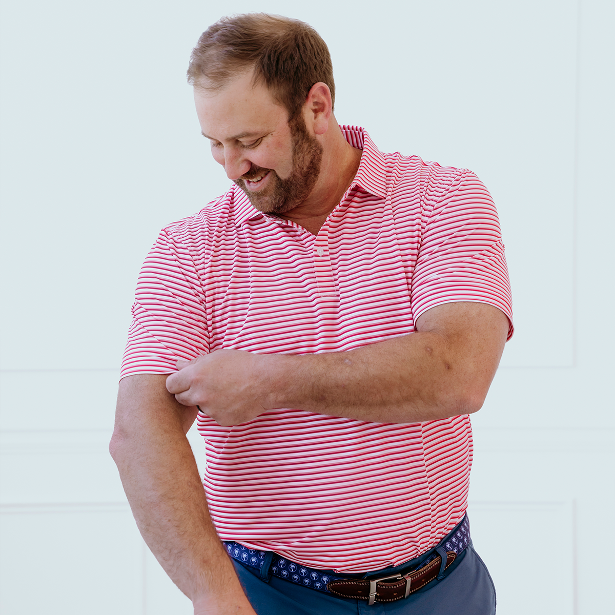 Front view of the Palmetto Clothing The Double Double Polo in Pink showcasing the bold double stripe pattern and premium construction. A modern stripe golf polo built for golfers who appreciate standout style.