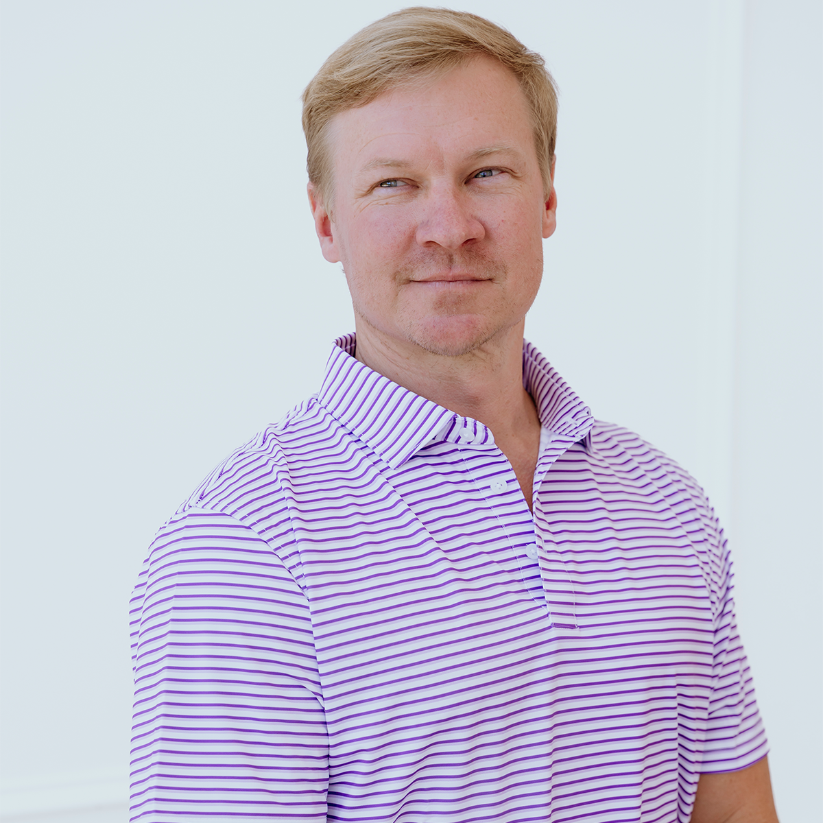 Front view of the Palmetto Clothing The Double Double Polo in Purple showcasing the modern double stripe pattern and premium construction. A stylish performance golf polo built for golfers who appreciate timeless design.