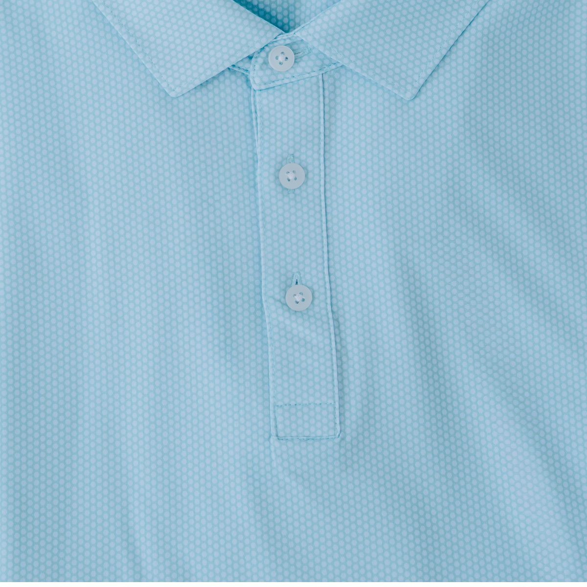 Close-up product detail of the Palmetto Clothing The Hex Polo in Teal showcasing the premium fabric, subtle geometric hex pattern, refined stitching, and craftsmanship behind our performance golf polos.