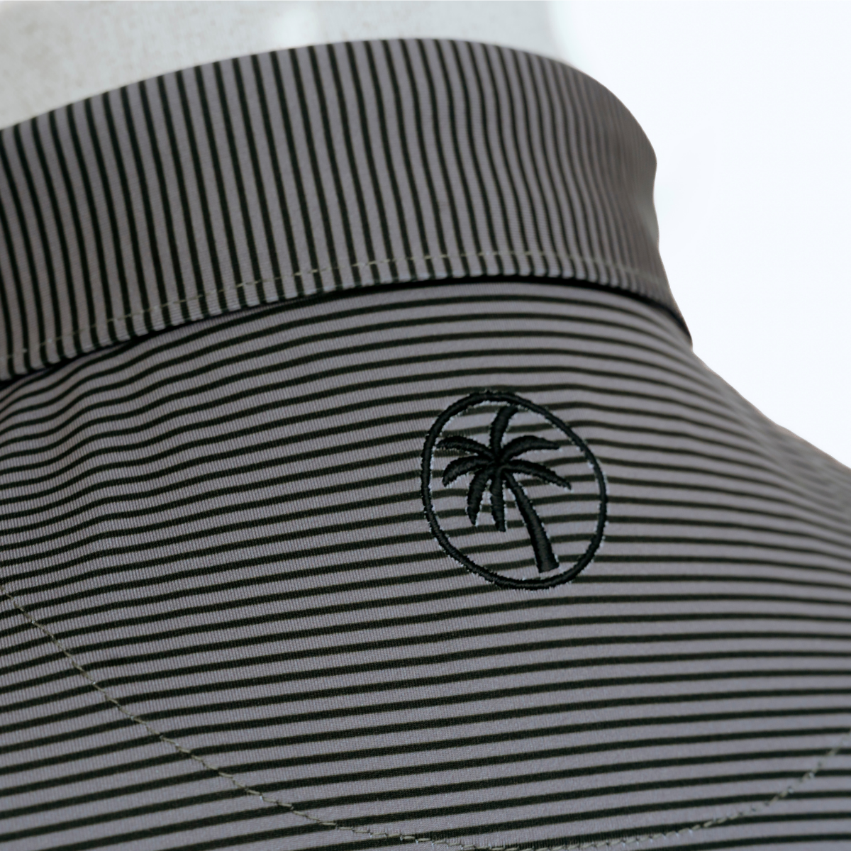 Close-up product detail of the Palmetto Clothing The Micro Polo showcasing the premium fabric, subtle repeating stripe pattern, refined stitching, and craftsmanship behind this modern golf top with timeless style and exceptional comfort.