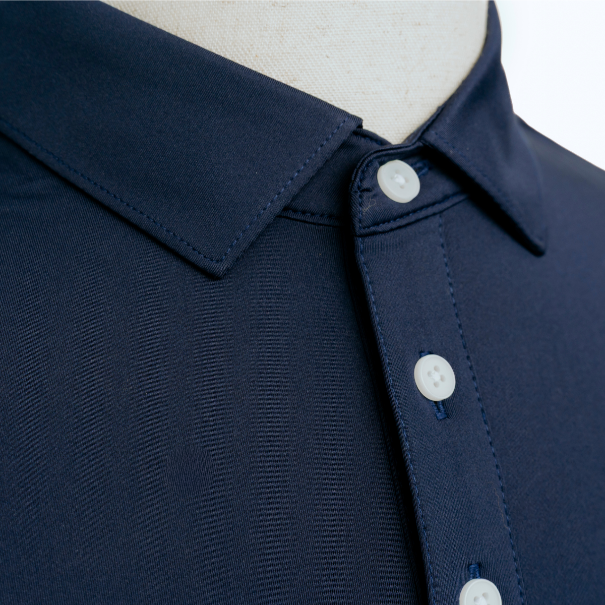 Detailed close-up of the Palmetto Clothing The Wayne Polo in Navy showcasing the premium fabric, smooth finish, and craftsmanship behind this classic navy blue golf shirt.
