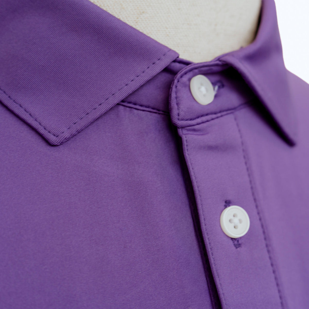 Close-up product detail of the Palmetto Clothing The Wayne Polo in Purple showcasing premium fabric, refined stitching, and the craftsmanship behind our high quality golf shirts.