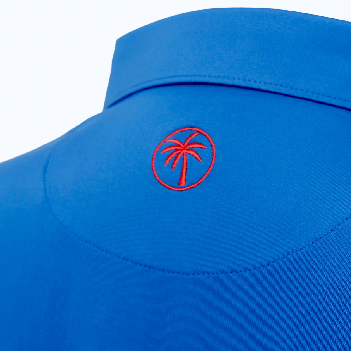 Back view of the Palmetto Clothing The Wayne Polo in Royal Blue highlighting the lightweight performance fabric and athletic fit of this premium golf polo.