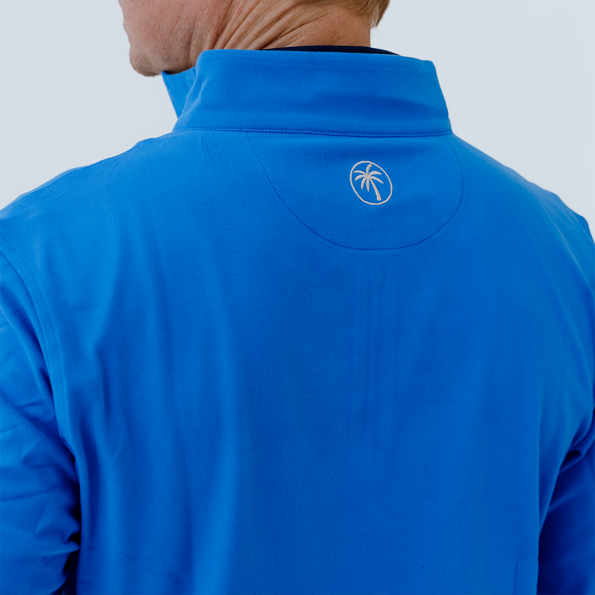 Back view of the Palmetto Clothing Classic Blue golf quarter-zip highlighting its clean lines, athletic fit, and premium golf apparel quality.