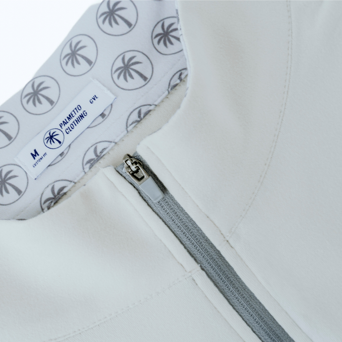 Detailed view of the Palmetto Clothing Light Gray quarter-zip featuring premium fabric, refined stitching, and lightweight performance golf apparel.