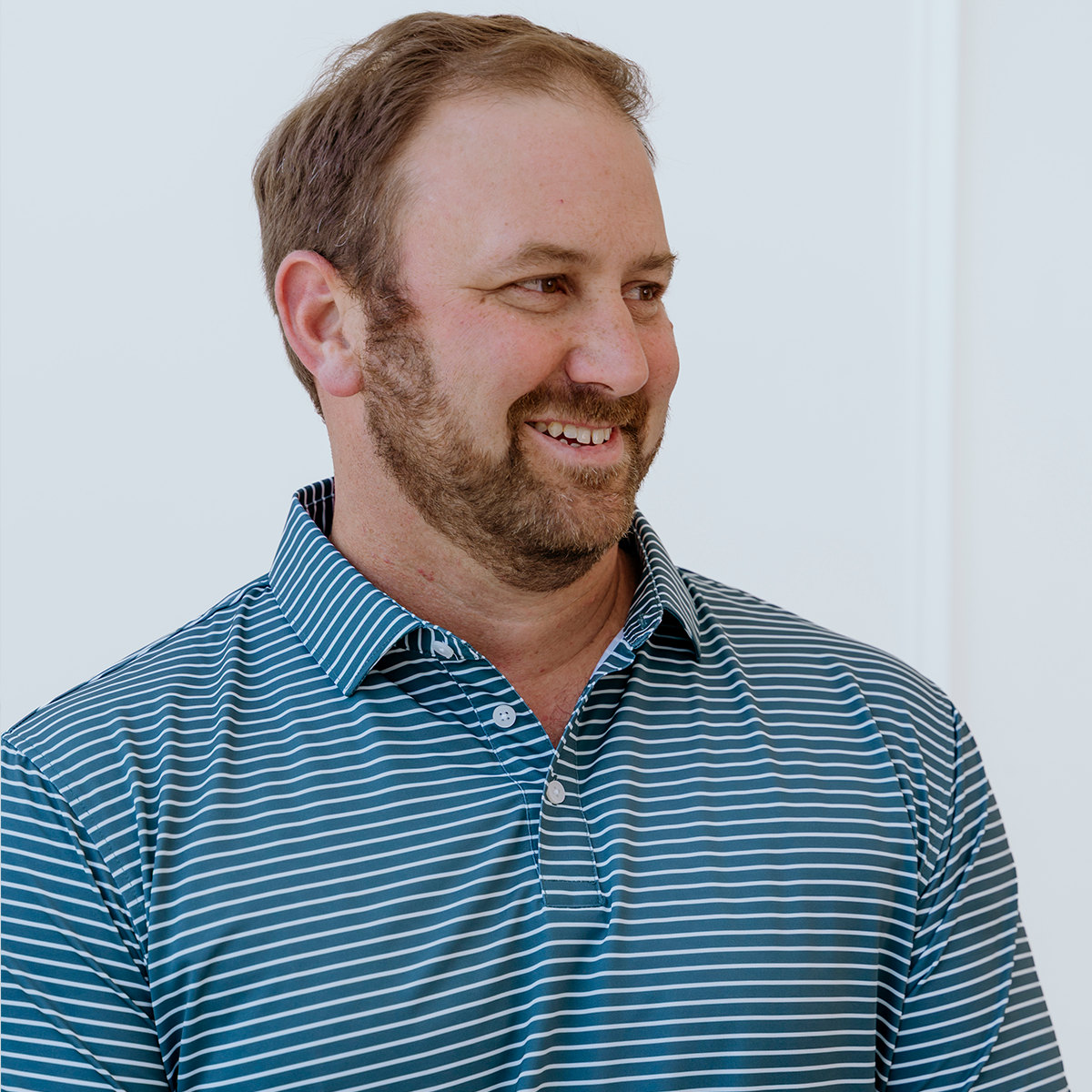 Front view of the Palmetto Clothing The Anderson Polo in Aquamarine showcasing the modern stripe design and premium construction. One of our premium golf polo shirts built for style, comfort, and performance.