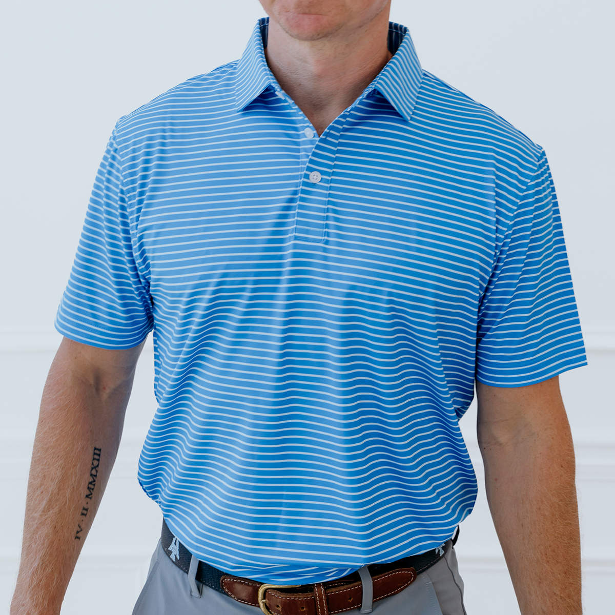 Front view of the Palmetto Clothing The Anderson Polo in French Blue showcasing the modern stripe pattern and premium construction. Part of our collection of best golf apparel designed for golfers who appreciate exceptional comfort.