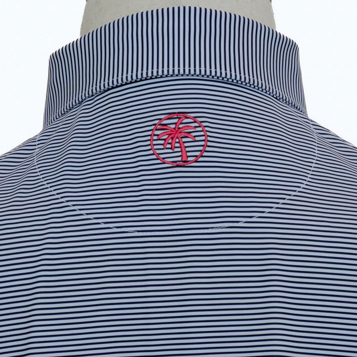 Back view of the Palmetto Clothing The Classic Stripe Polo in Navy Blue highlighting the athletic fit, breathable construction, and premium performance fabric built for golf and beyond.