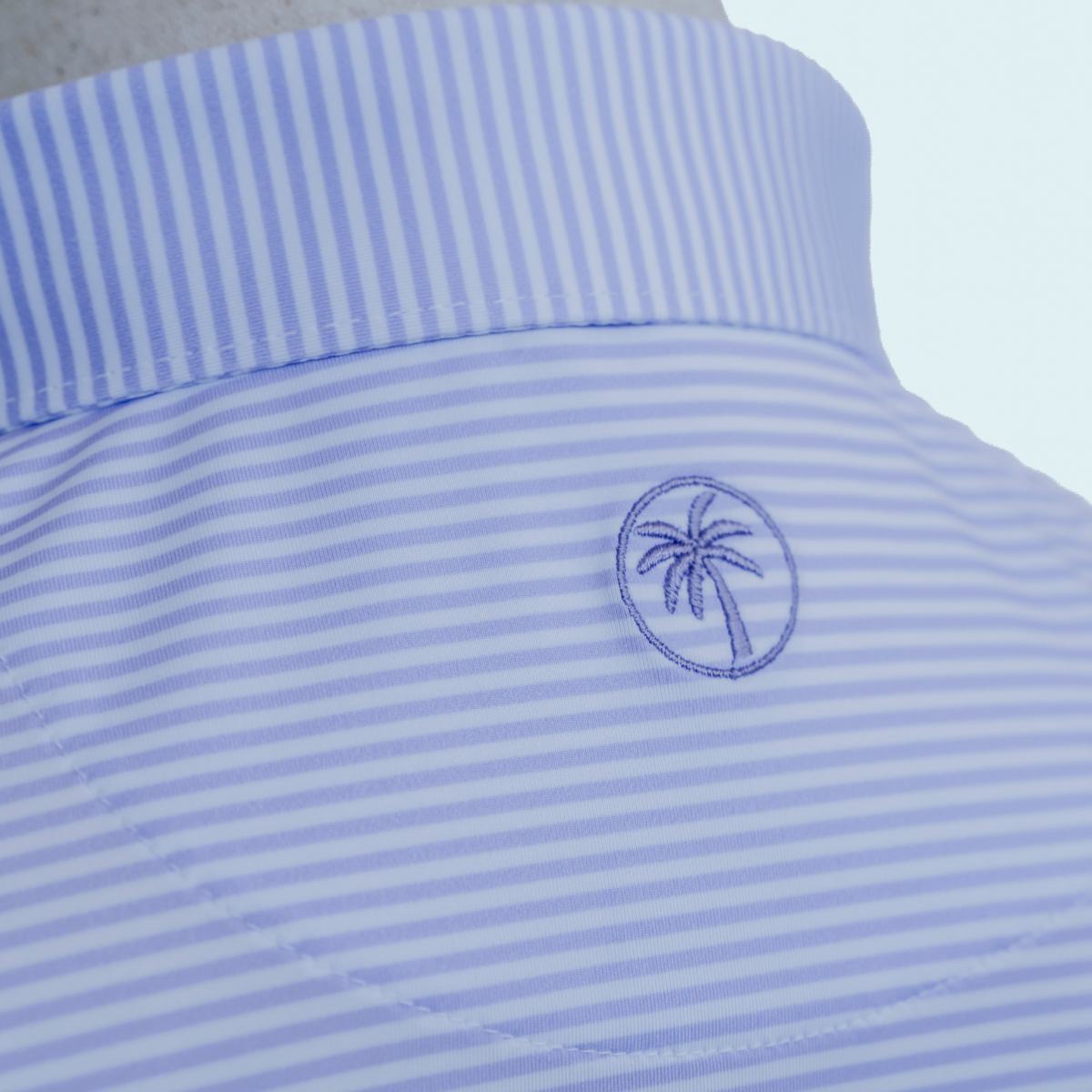 Back view of the Palmetto Clothing The Classic Stripe Polo in Lavender highlighting the tailored fit and breathable performance fabric designed for golfers who appreciate premium golf apparel.