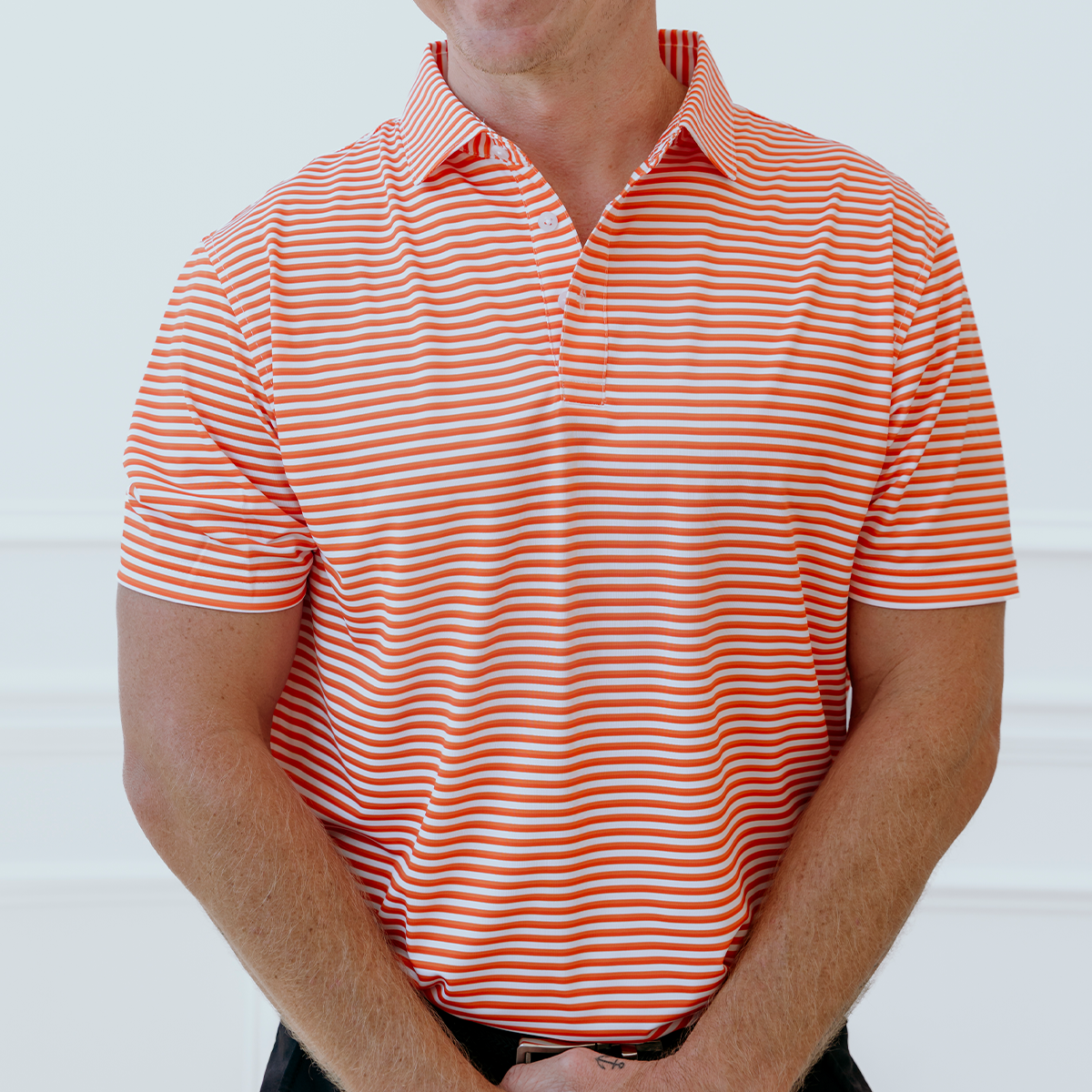 Front view of the Palmetto Clothing The Double Double Polo in Orange showcasing the bold double stripe pattern and premium construction. Part of our best golf apparel collection designed for comfort and timeless style.