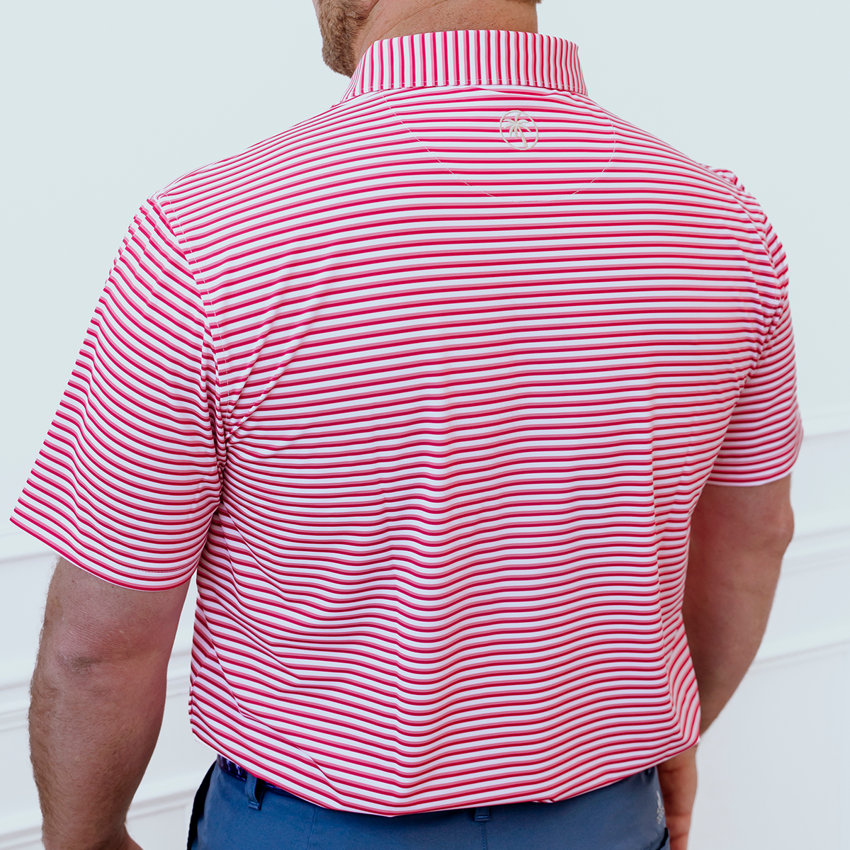 Back view of the Palmetto Clothing The Double Double Polo in Pink highlighting the athletic fit, breathable performance fabric, and exceptional comfort that make it part of our best golf apparel collection.