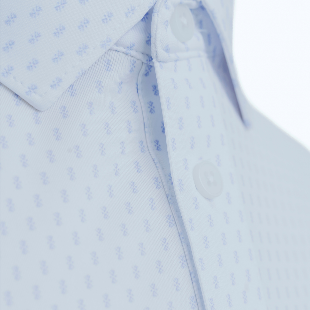 Close-up product detail of the Palmetto Clothing The Flake Polo showcasing the premium fabric, signature blue flake pattern, refined stitching, and craftsmanship behind one of our favorite patterned golf polos.