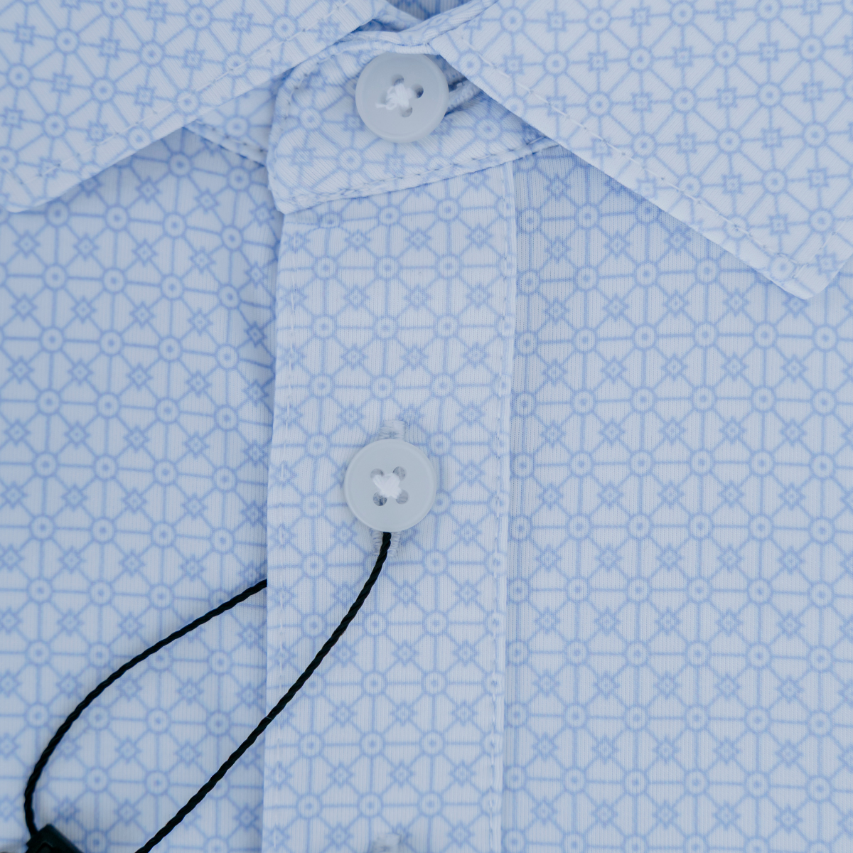 Close-up product detail of the Palmetto Clothing The Fractal Polo showcasing the premium fabric, repeating geometric pattern, refined stitching, and craftsmanship behind one of our most comfortable breathable golf polo shirts.