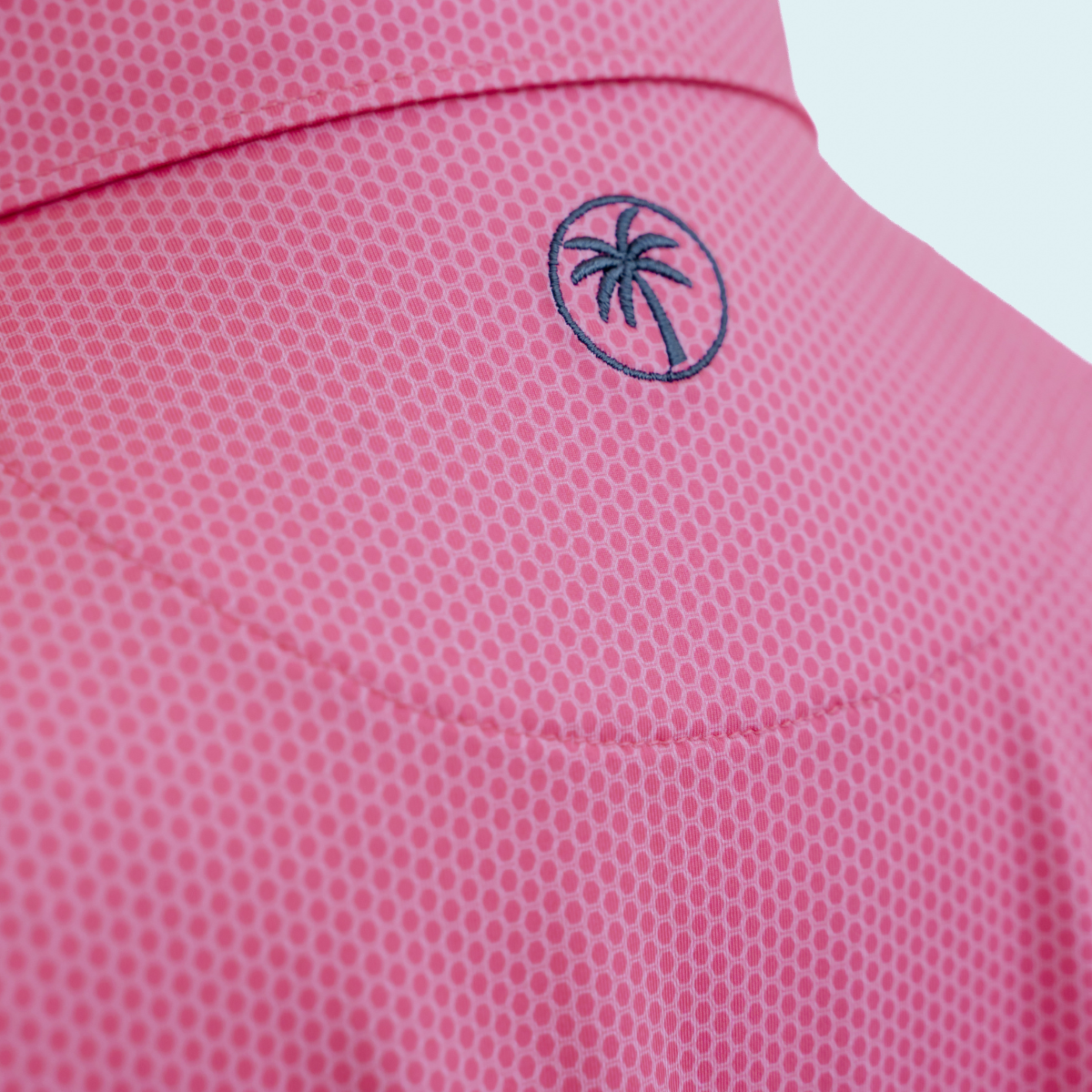 Back view of the Palmetto Clothing The Hex Polo in Bright Pink highlighting the athletic fit, breathable construction, and premium performance fabric that make it part of our golf polo shirts collection.