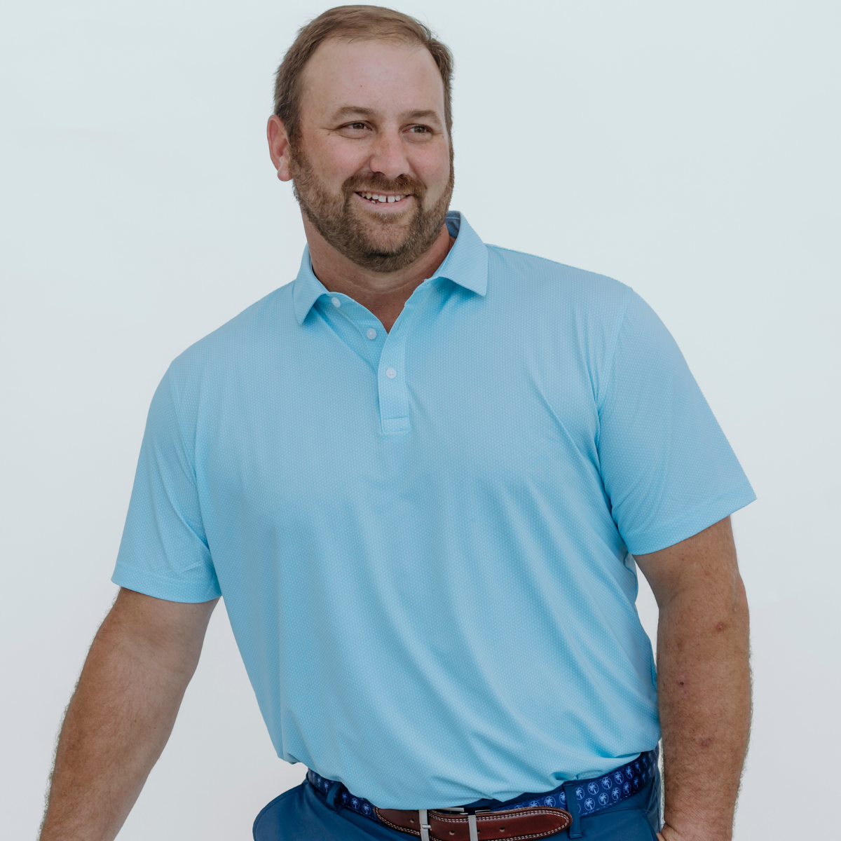 Front view of the Palmetto Clothing The Hex Polo in Teal showcasing the subtle all-over hex pattern and premium construction. A modern performance golf polo designed with breathable fabric and all-day comfort.