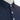 Close-up product detail of the Palmetto Clothing The Icon Polo in Navy and Blue showcasing the premium fabric, repeating logo design, refined stitching, and craftsmanship that make it one of our best golf polos.