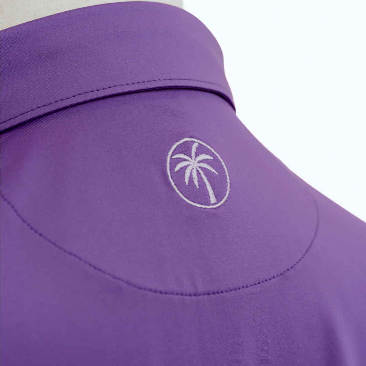 Back view of the Palmetto Clothing The Wayne Polo in Purple highlighting its breathable fabric, modern fit, and exceptional comfort for golfers.