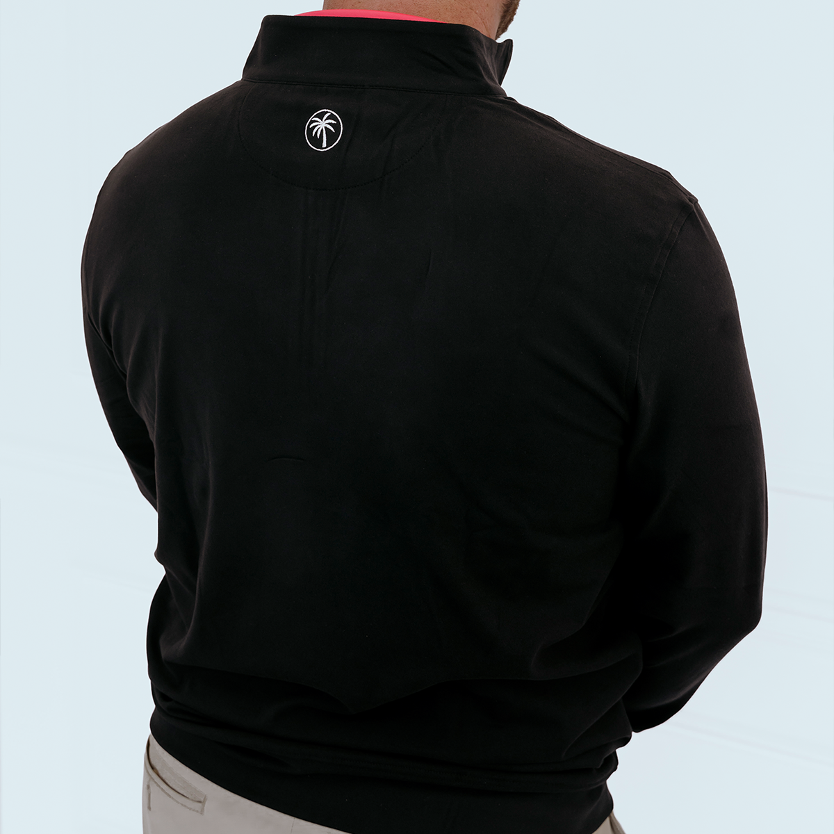 Back view of the Palmetto Clothing Black Thomas golf quarter-zip showcasing its clean design, modern fit, and premium performance golf clothing for everyday wear.